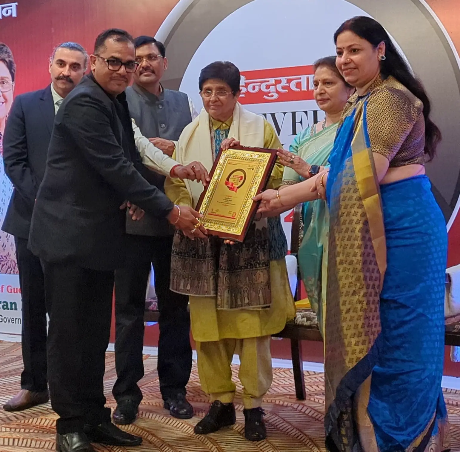 Rajesh Khanna, Managing Director of Riddhima Packers, receiving an award on stage